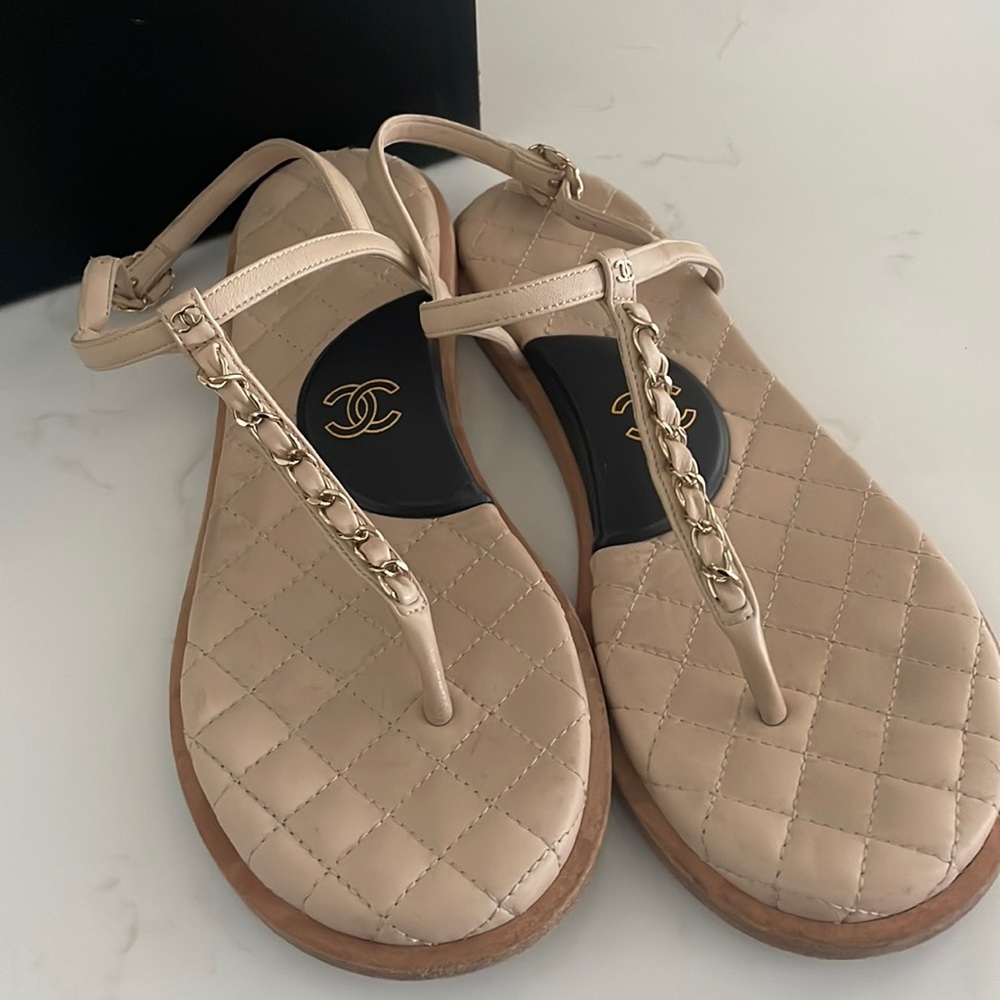 Chanel cream and black sandals.